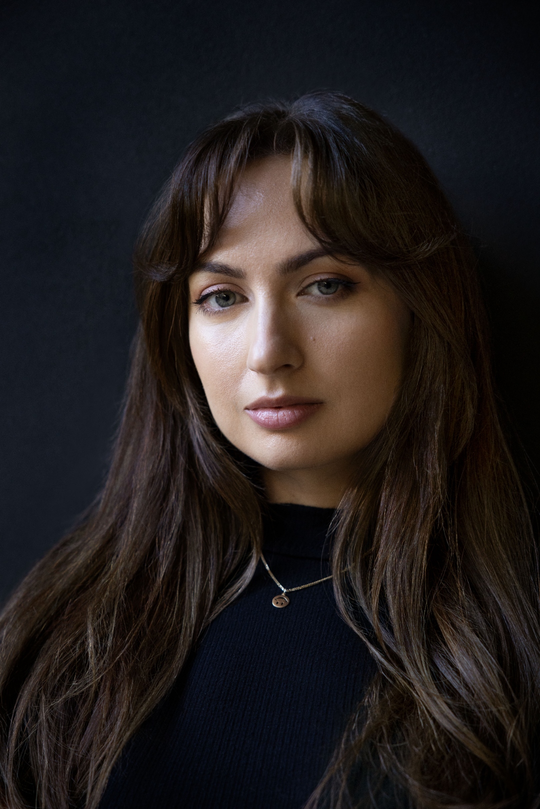 Kate Tolo — headshot on dark background, co-founder of Blueprint