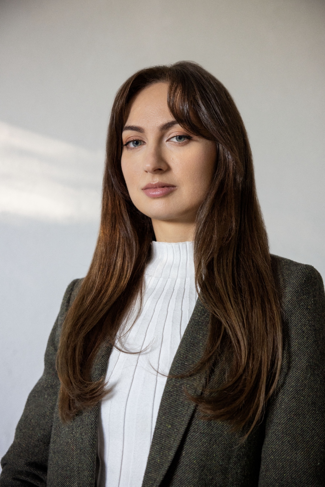 Kate Tolo — portrait in blazer, entrepreneur